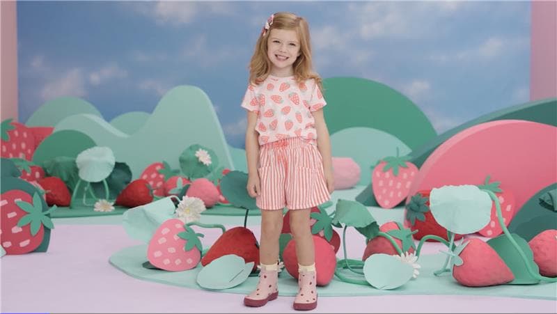 Girl standing in flower field